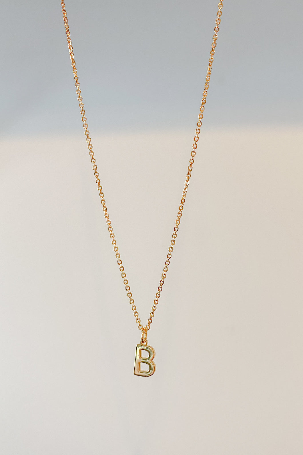 Gold initial charm necklace