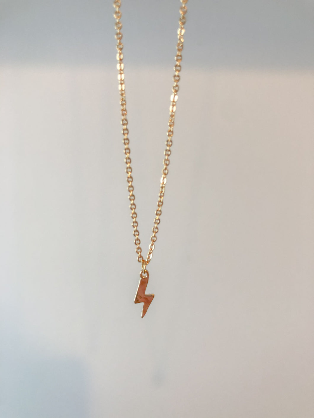 Mini gold lightning bolt necklace