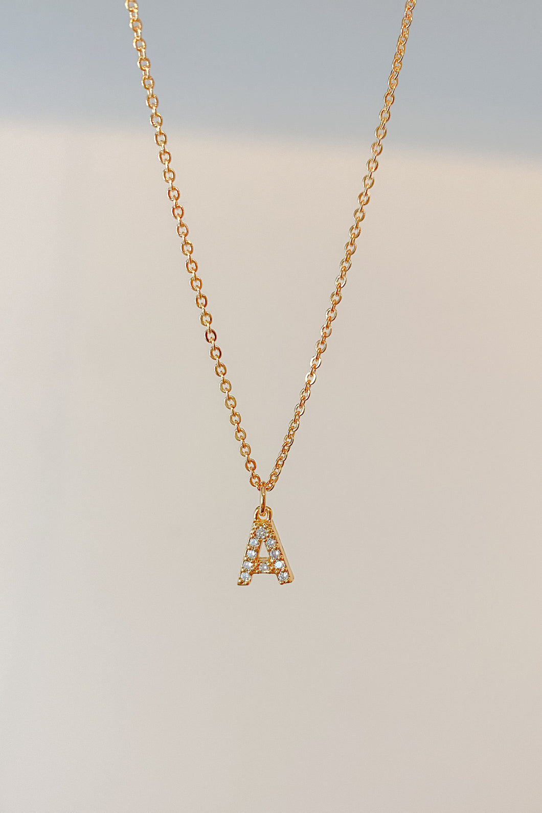 Pave initial charm necklace