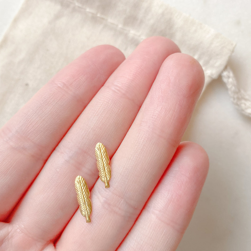 Gold feather stud earrings